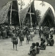 Carrying Water in Coconut Shells - A Village Scene in New Guinea c1930s. Creator: Unknown