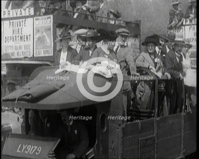 Cars, Buses and Pedestrians Arriving for the 1920 Epsom Derby, 1920. Creator: British Pathe Ltd.