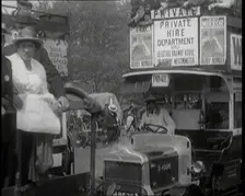 Cars, Buses and Pedestrians Arriving for the 1920 Epsom Derby, 1920. Creator: British Pathe Ltd