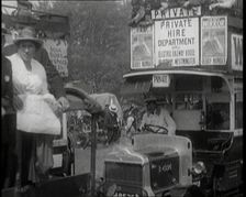Cars, Buses and Pedestrians Arriving for the 1920 Epsom Derby, 1920. Creator: British Pathe Ltd