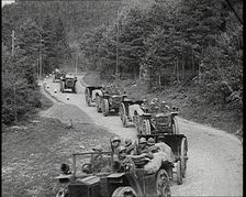 Cars Carrying Italian Troops Driving Through the Alps, 1930s. Creator: British Pathe Ltd