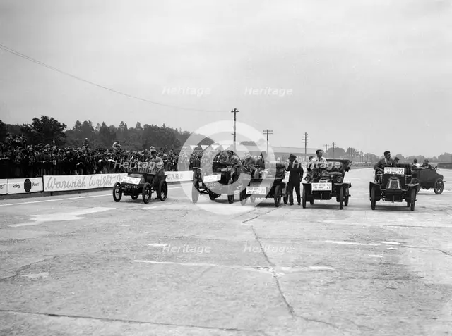 Cars competing in the BARC Daily Sketch Old Crocks Race, Brooklands, 1931. Artist: Bill Brunell.