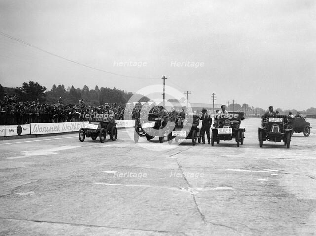 Cars competing in the BARC Daily Sketch Old Crocks Race, Brooklands, 1931. Artist: Bill Brunell.
