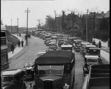 Cars Driving Down a Road Towards the Camera, 1930s. Creator: British Pathe Ltd