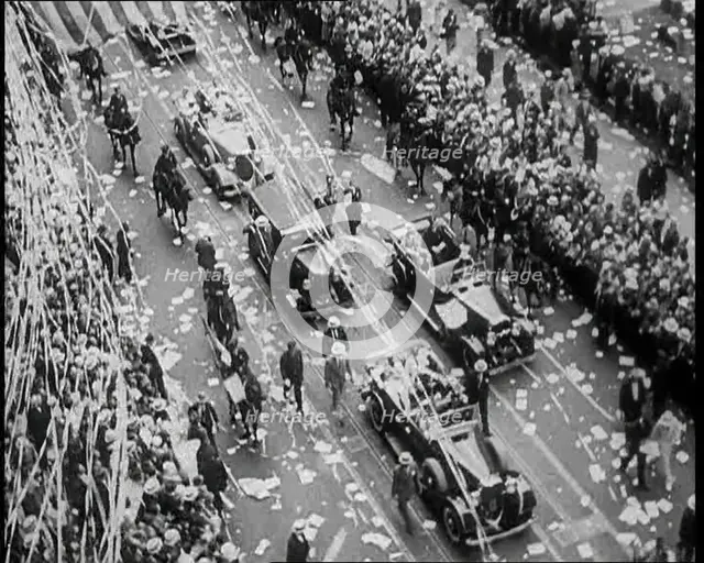 Cars Driving Down in a Parade Watched by Crowds, 1933. Creator: British Pathe Ltd.