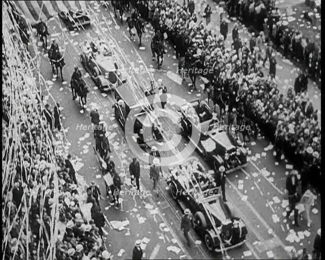 Cars Driving Down in a Parade Watched by Crowds, 1933. Creator: British Pathe Ltd.