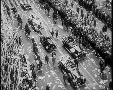 Cars Driving Down in a Parade Watched by Crowds, 1933. Creator: British Pathe Ltd