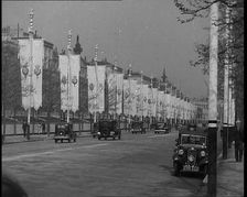 Cars Driving Down the Mall Which Is Decorated By Flags For the Coronation of King George VI, 1937. Creator: British Pathe Ltd