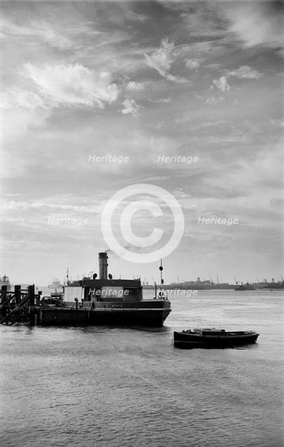 Cars embark on a ferry at Gravesend, Kent, for an evening crossing of the Thames, c1945-c1965. Artist: SW Rawlings