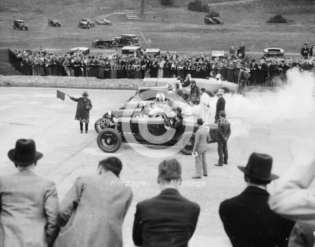 Cars lined up for the start of a race, Brooklands, Surrey, c 1925-c1930. Artist: Unknown