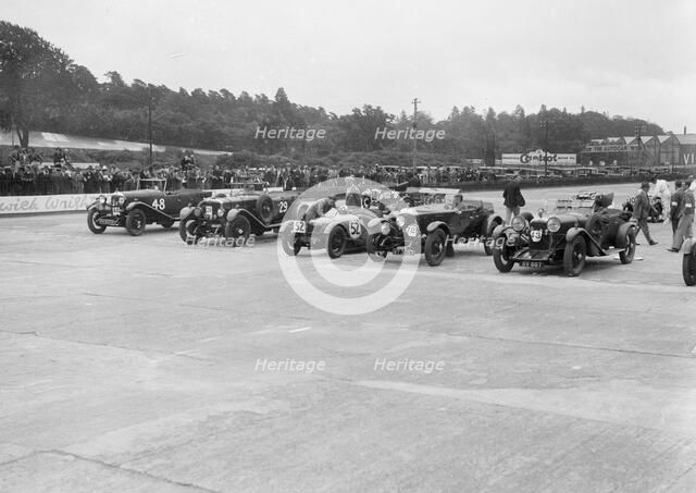 Cars on the start line at the JCC Members Day, Brooklands, 4 July 1931. Artist: Bill Brunell.