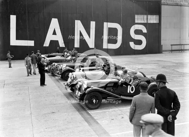 Cars on the start line at the MCC Members Meeting, Brooklands, 10 September 1938. Artist: Bill Brunell.
