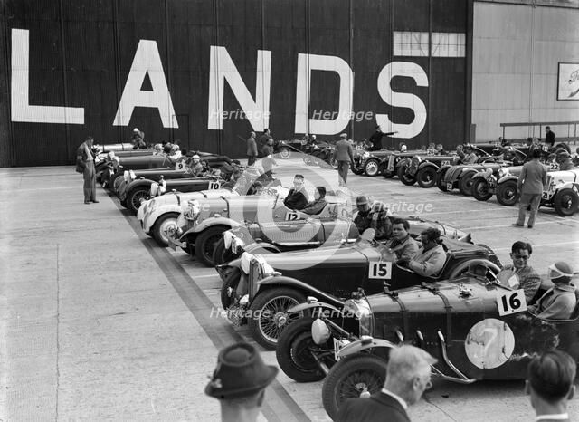 Cars on the start line at the MCC Members Meeting, Brooklands, 10 September 1938. Artist: Bill Brunell.