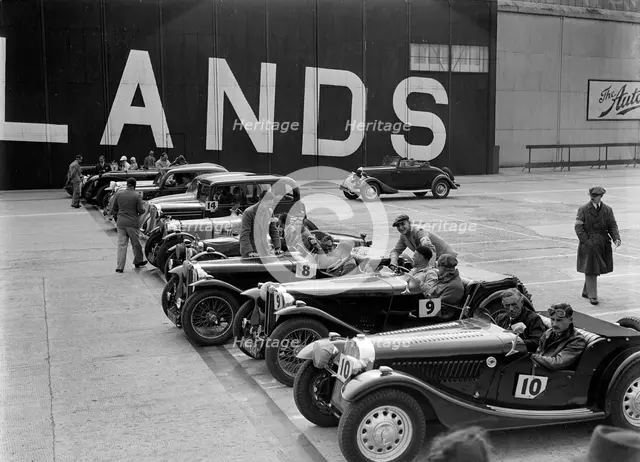 Cars on the start line at the MCC Members Meeting, Brooklands, 10 September 1938. Artist: Bill Brunell.