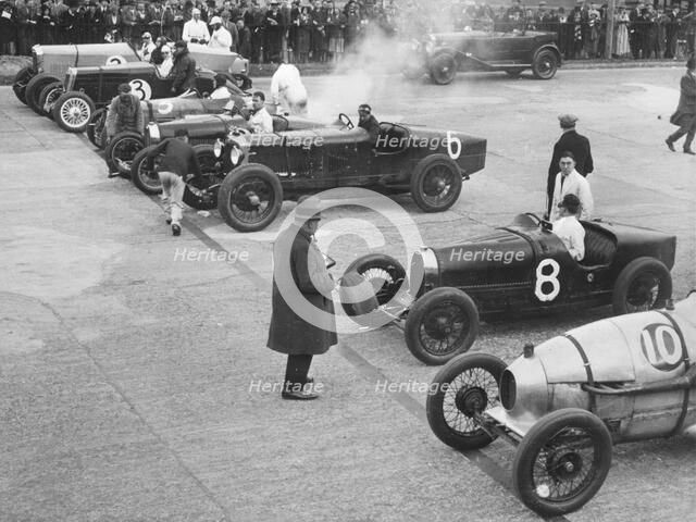 Cars on the start line at a BARC meeting, Brooklands, 1930. Artist: Bill Brunell.