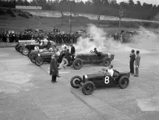 Cars on the start line at a BARC meeting, Brooklands, 1930. Artist: Bill Brunell