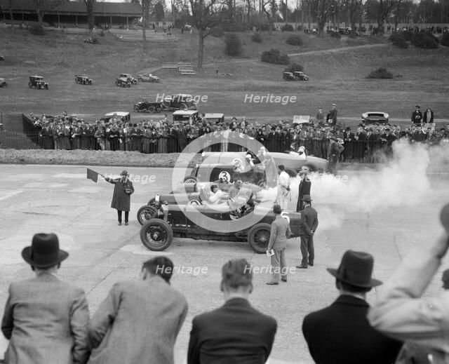 Cars on the start line at a BARC race meeting, Brooklands, 1930. Artist: Bill Brunell.