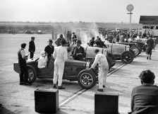 Cars on the start line, Surbiton Motor Club race meeting, Brooklands, Surrey, 1928. Artist: Bill Brunell