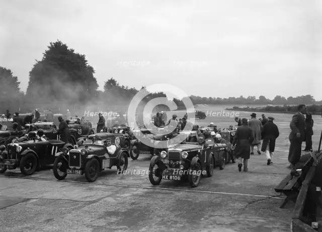 Cars on the starting grid for the Brighton & Hove Motor Club High Speed Trial, Brooklands, c1931. Artist: Bill Brunell.