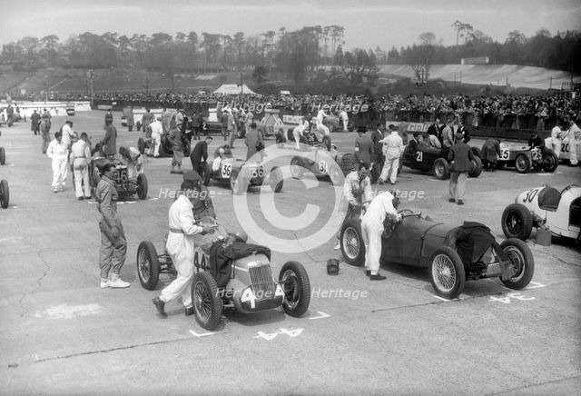Cars on the starting grid for the JCC International Trophy, Brooklands, 2 May 1936. Artist: Bill Brunell.