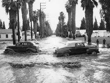 Cars on a flooded road in California, USA