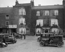 Cars parked outside the Fleece Hotel, Thirsk, Yorkshire, Ilkley & District Motor Club Trial, 1930s. Artist: Bill Brunell
