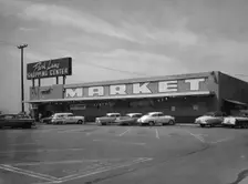 Cars parked outside a supermarket, USA, c1956