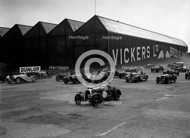 Cars racing at the MCC Members Meeting, Brooklands, 10 September 1938. Artist: Bill Brunell.