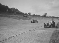 Cars racing on Byfleet Banking during the BRDC 500 Mile Race, Brooklands, 3 October 1931. Artist: Bill Brunell