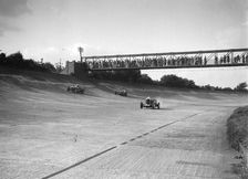Cars racing on Byfleet Banking during the BRDC 500 Mile Race, Brooklands, 3 October 1931. Artist: Bill Brunell