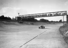 Cars racing on Byfleet Banking during the BRDC 500 Mile Race, Brooklands, 3 October 1931. Artist: Bill Brunell