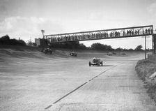 Cars racing on Byfleet Banking during the BRDC 500 Mile Race, Brooklands, 3 October 1931. Artist: Bill Brunell
