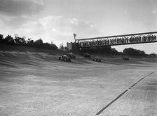 Cars racing on Byfleet Banking during the BRDC 500 Mile Race, Brooklands, 3 October 1931. Artist: Bill Brunell