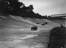 Cars racing on the Members Banking at a JCC Members Day, Brooklands. Artist: Bill Brunell