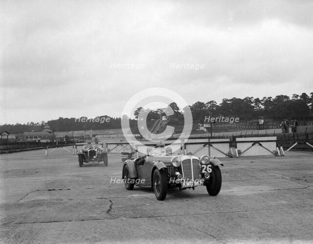 Cars racing through the chicane, JCC Members Day, Brooklands, 8 July 1939. Artist: Bill Brunell.
