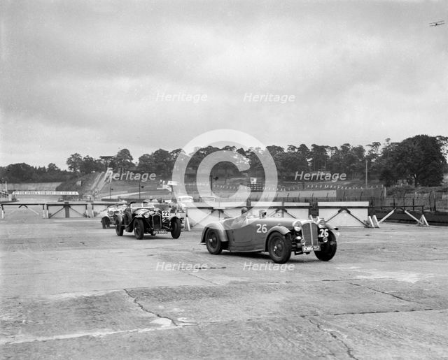 Cars racing through the chicane, JCC Members Day, Brooklands, 8 July 1939. Artist: Bill Brunell.