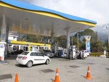 Cars re-fuelling at petrol station Dharamshala Himachal Pradesh. Creator: Unknown