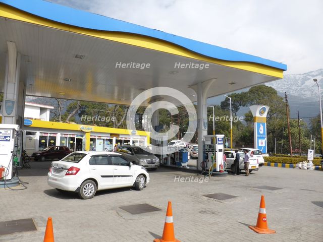 Cars re-fuelling at petrol station Dharamshala Himachal Pradesh. Creator: Unknown.