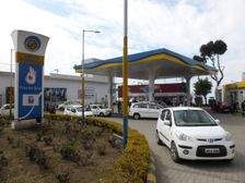 Cars re-fuelling at petrol station Dharamshala Himachal Pradesh. Creator: Unknown