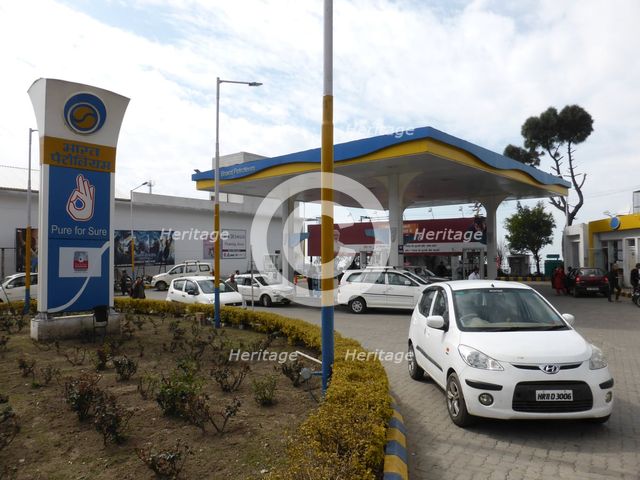 Cars re-fuelling at petrol station Dharamshala Himachal Pradesh. Creator: Unknown.