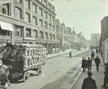 Cart laden with sacks, Mansell Street, Stepney, London, 1914