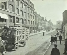 Cart laden with sacks, Mansell Street, Stepney, London, 1914