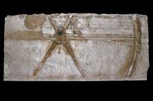 Carved and painted limestone block with depiction of a chariot wheel, 1353 BC-1335 BC