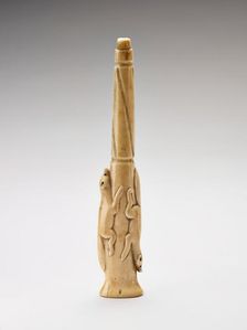 Carved harpoon foreshaft with two running foxes carved in relief, 1880-1920. Creator: Unknown