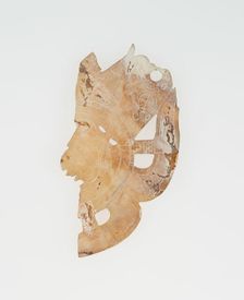 Carved Shell Depicting the Profile Face of Diety (Broken), A.D. 250/900. Creator: Unknown