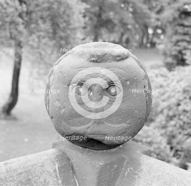 Carved Victorian stone head on a garden wall, Speke Hall, Liverpool, Merseyside, c1945-c1980. Artist: Eric de Maré.