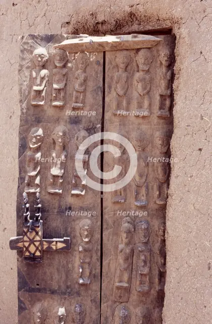 Carved wooden door, Pays Dogon, Mali, 1990. Creator: Amanda Waite.