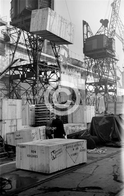 Cased car parts bound for Australia being loaded, King George V Dock, London, c1945-c1965. Artist: SW Rawlings