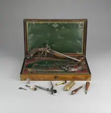 Cased Pair of Percussion Pistols with Accessories, France, 1814. Creator: Jean Le Page
