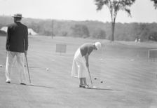 Cassidy, Ellen, Mrs., playing golf, 1932 July. Creator: Arnold Genthe